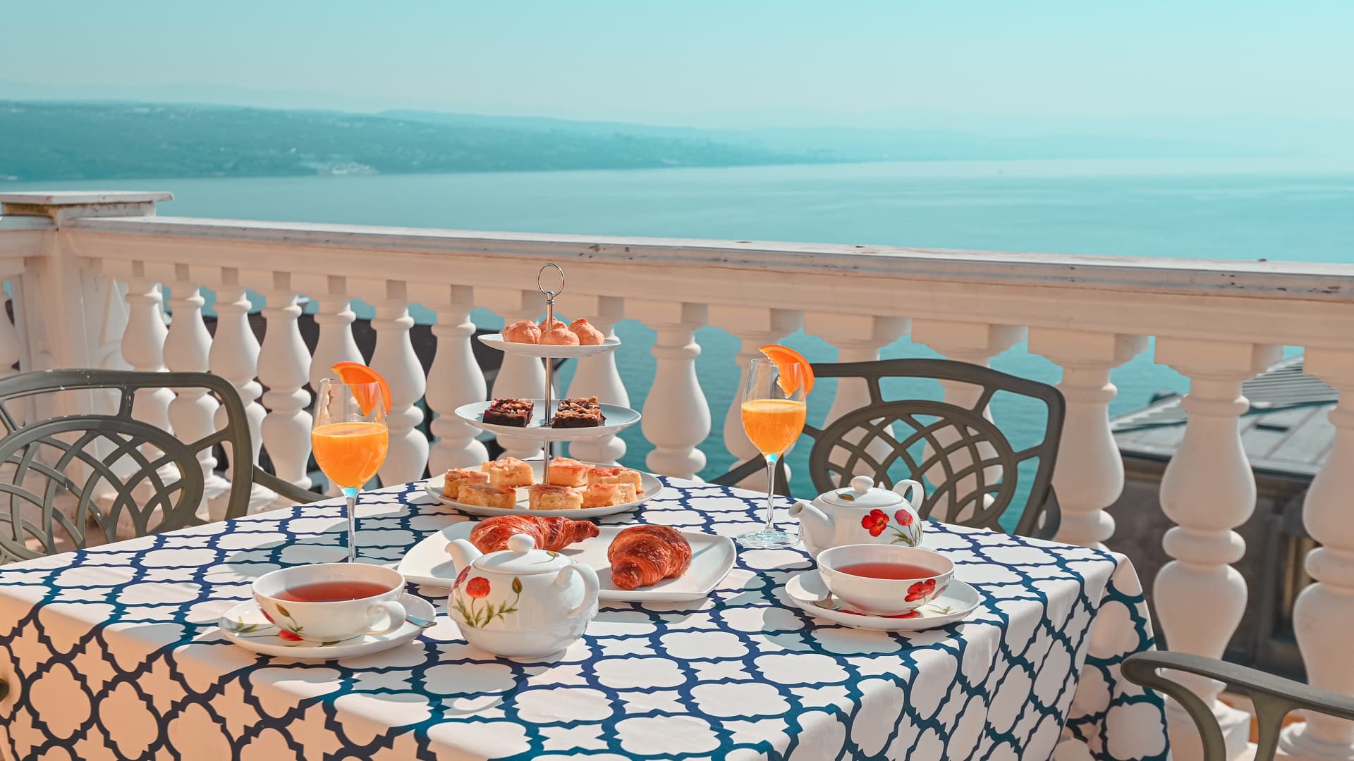 Balcony overlooking the sea with drinks at Amadria Park Hotel Continental, Opatija